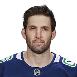 headshot of Derek
